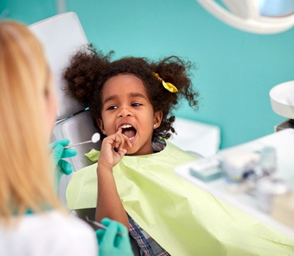 Young child having their teeth examined during age one dental visit in Franklin Park, IL