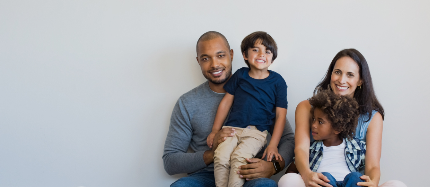 Family of four with healthy smiles