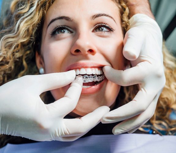 Woman wearing Invisalign in Franklin Park