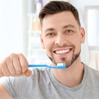 Guy brushing his teeth in Franklin Park 