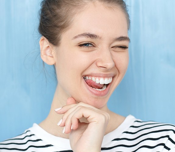 Woman's perfected smile after gum recontouring treatment