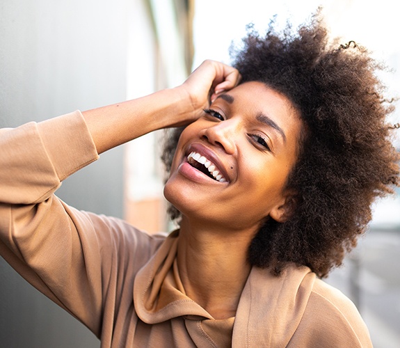 Woman's perfected smile after crown lengthening