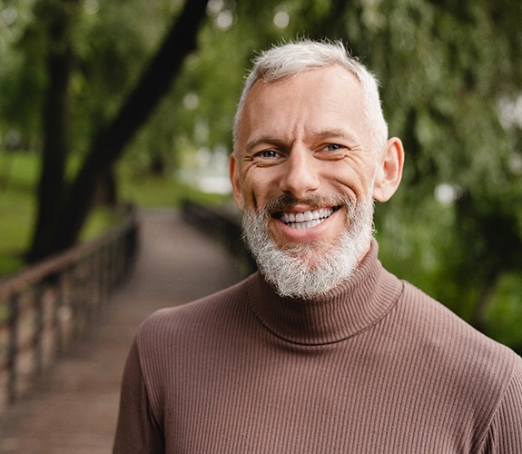 Man smiling after cost of dentures in Franklin Park