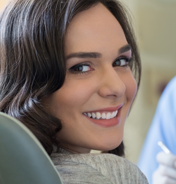 Woman with healthy smile after periodontal therapy