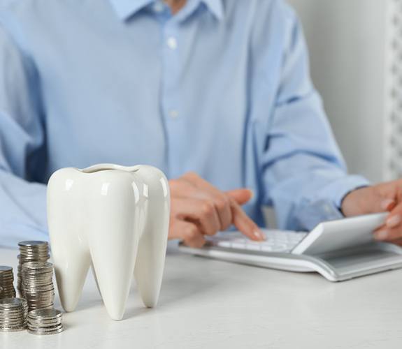 Dentist configuring the cost of tooth extractions in Franklin Park