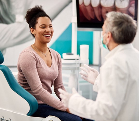 Younger woman with implant dentures 