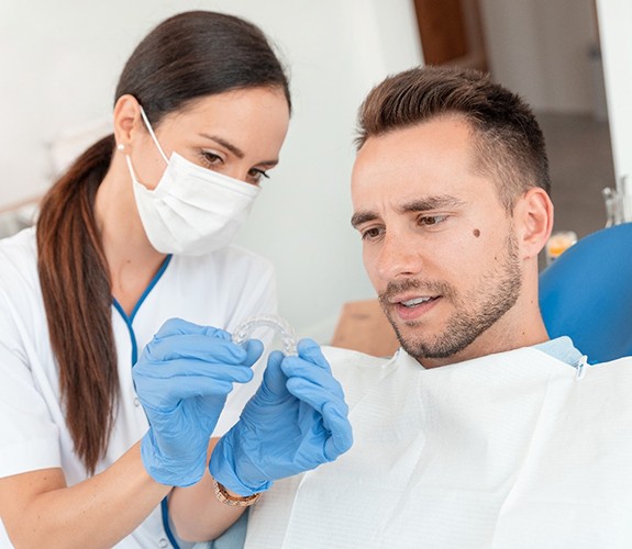 Patient and dentist discussing Invisalign in Franklin Park