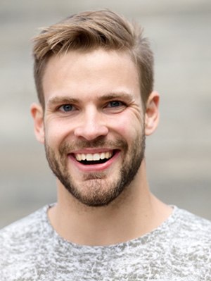 closeup of young man smiling