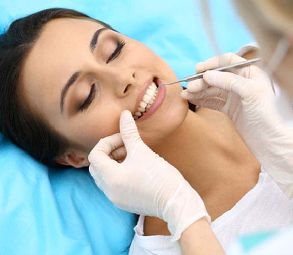 Woman receiving metal-free restorations in Franklin Park