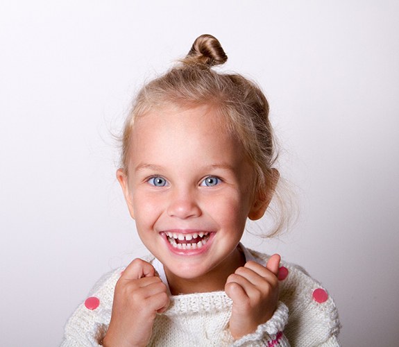 Happy young girl, should be evaluated for phase 1 orthodontics in Franklin Park