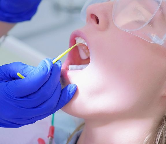 Patient receiving fluoride treatment