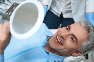 Man with dental implants in Franklin Park 