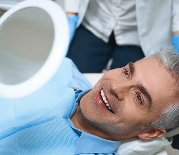 Man smiling after a root canal in Franklin Park