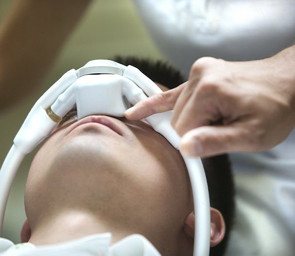 Patient receiving nitrous oxide dental sedation during dentistry visit