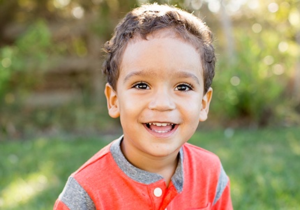 Young boy with healthy smile after after children's dentistry visit