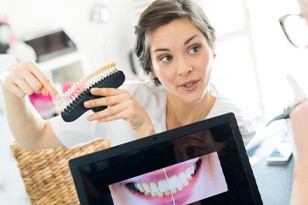 Dentist discussing veneers in Franklin Park  