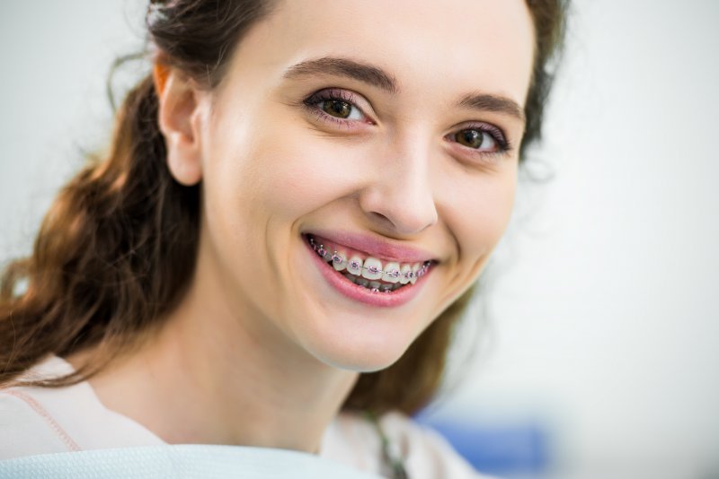 Close-up of a woman smiling with braces