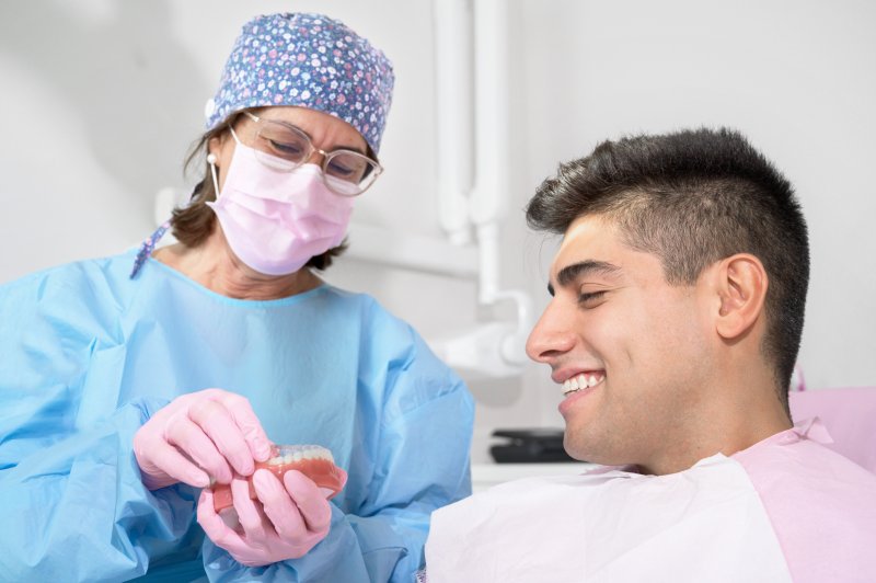 male patient learning about Invisalign 