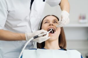 female patient receiving a dental cleaning